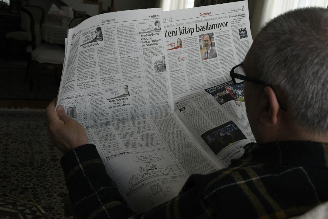writer researching old newspaper